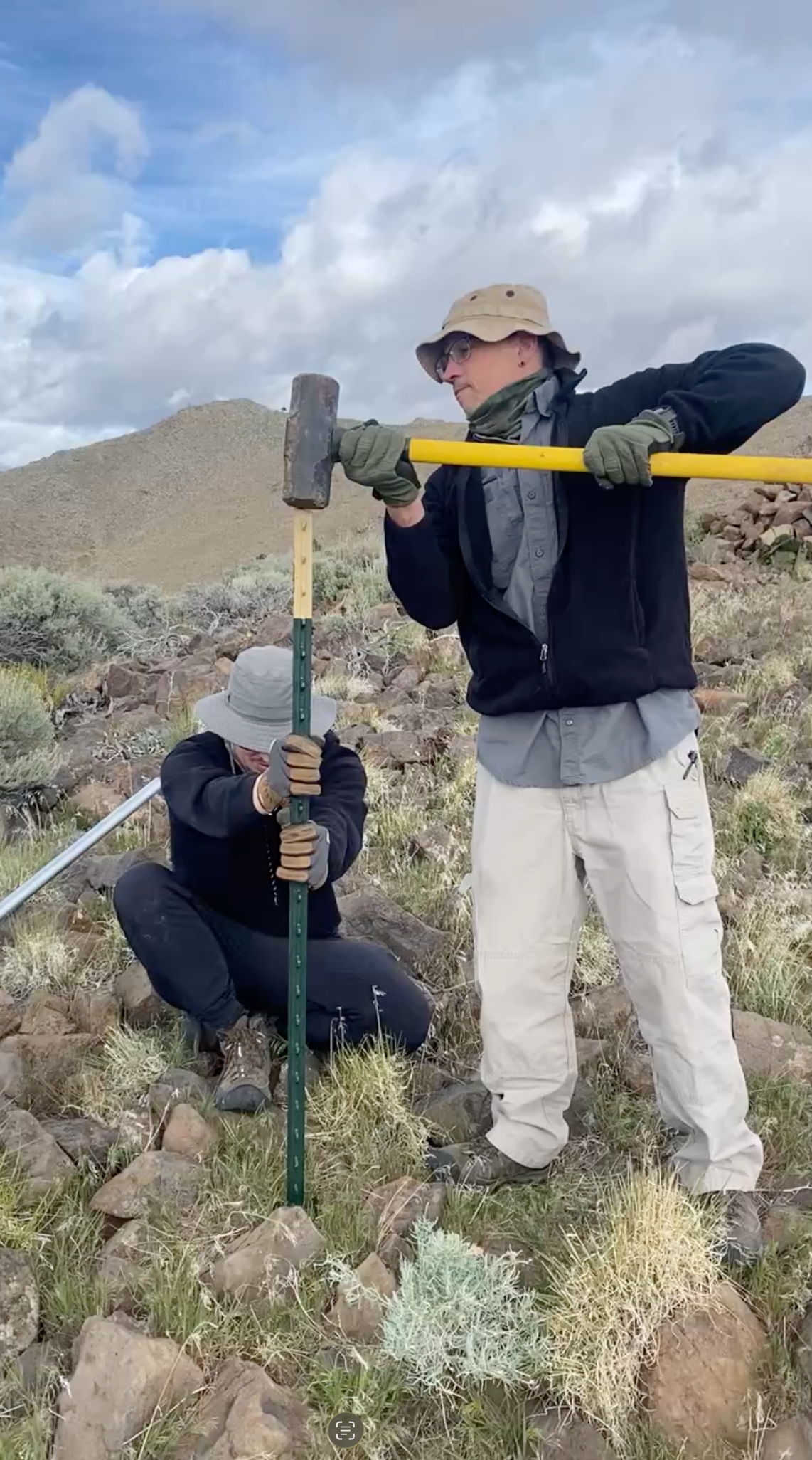 Driving a T-post for a mast anchor at Spanish Benchmark